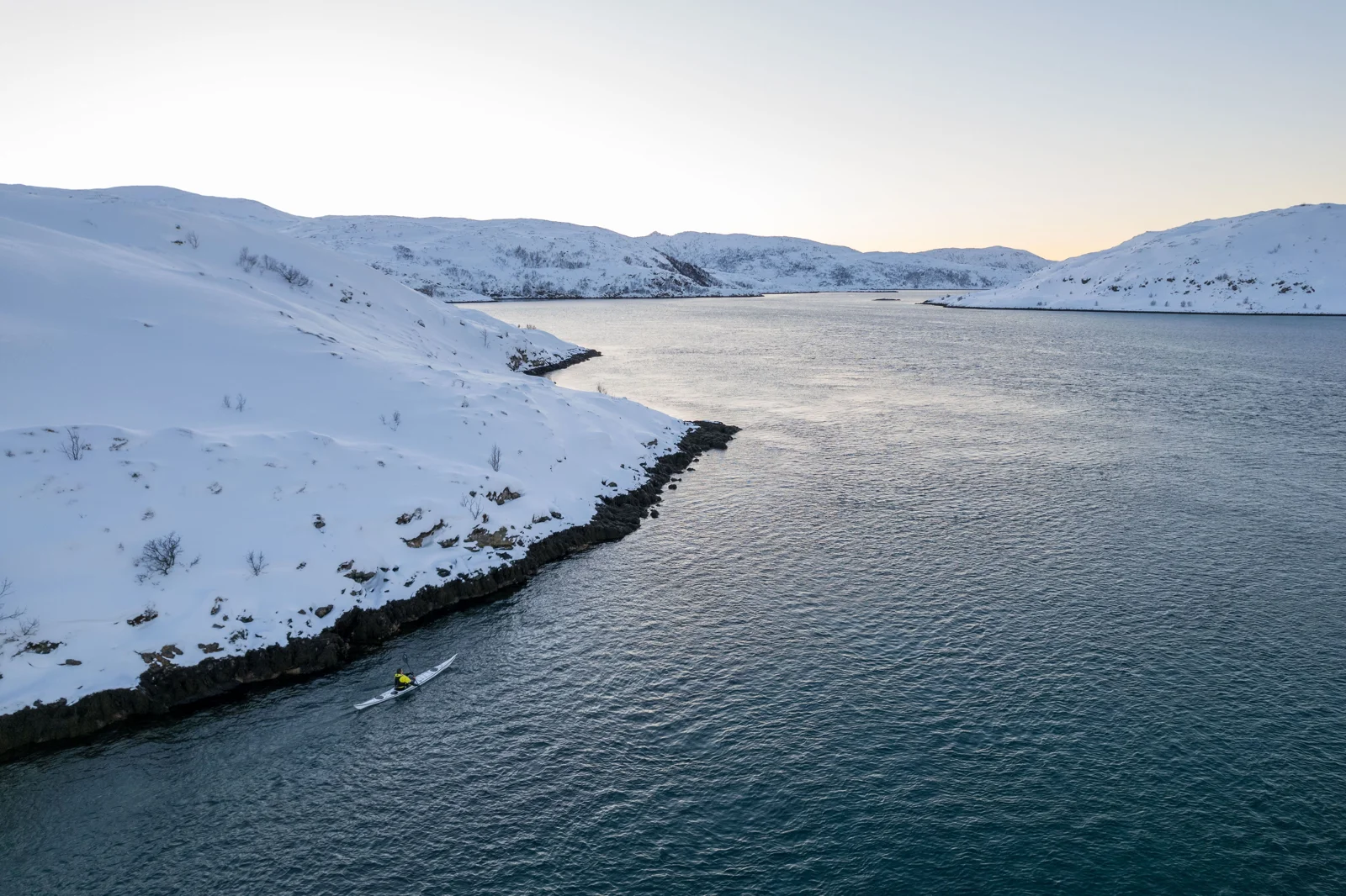 Kayakers exploring a Norwegian fjord